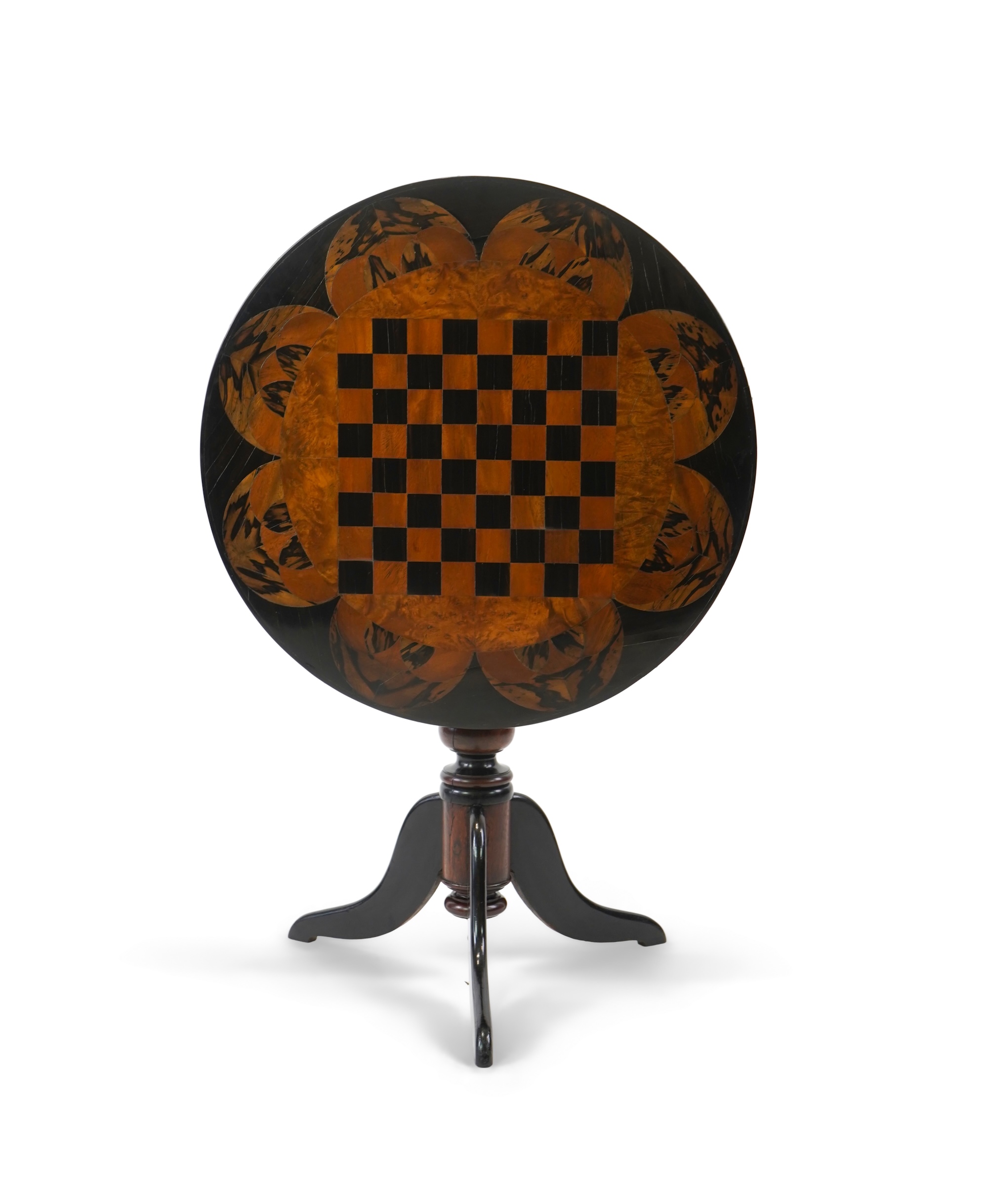 A 19th century Ceylonese ebony and specimen wood chess table